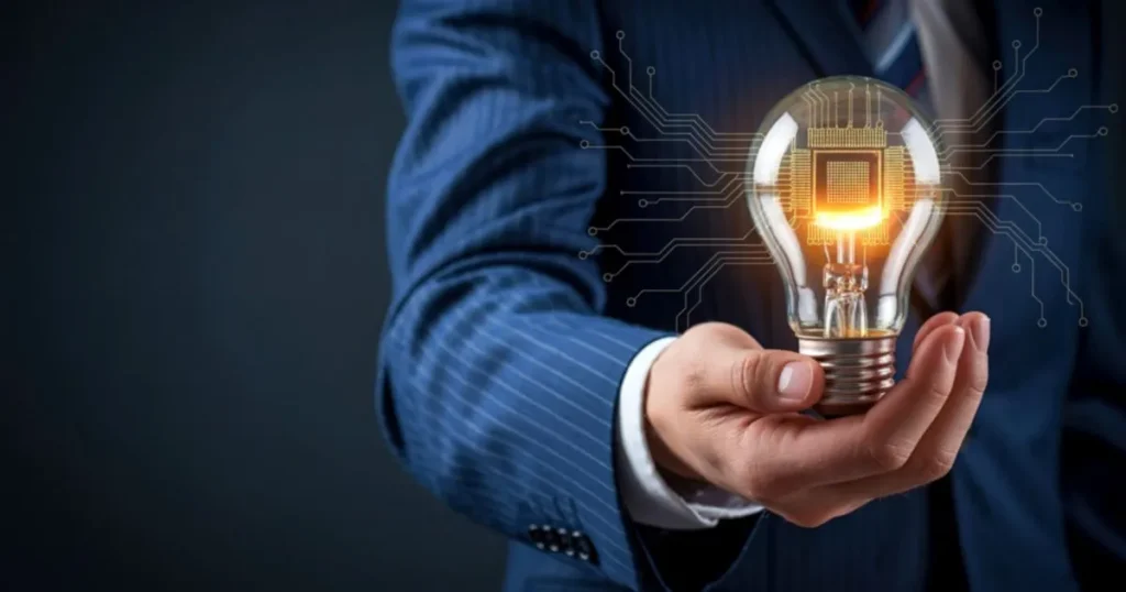 Podnikatel držící svítící žárovku jako symbol nového podnikatelského nápadu a inovace